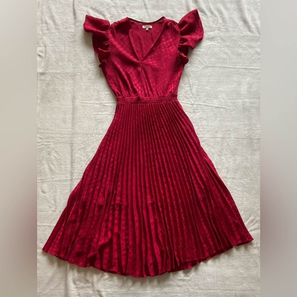 Red v-neck polka-dot, pleated skirt dress